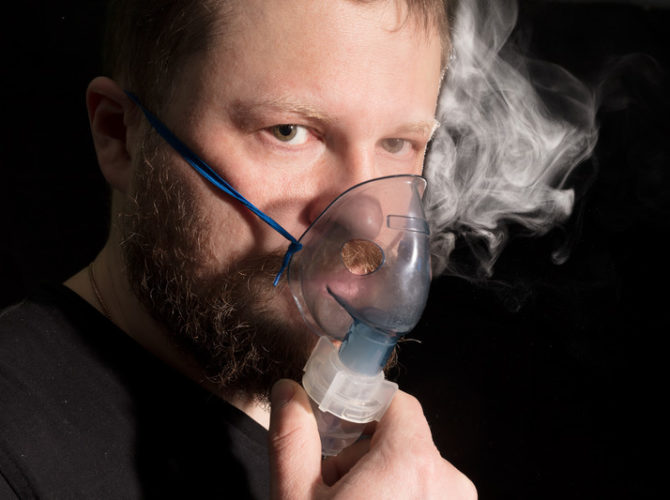 glutathione inhalation - 2 (man using a nebulizing mask)